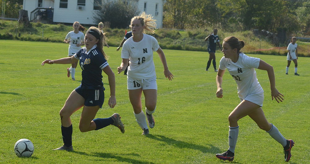 Pine Bush’s Tea Rauch moves the ball as Newburgh’s Ava Morrill (16) and Ava Esposito pursue during an OCIAA girls’ soccer game on Sept. 13 at E.J. Russell Elementary School in Pine Bush.